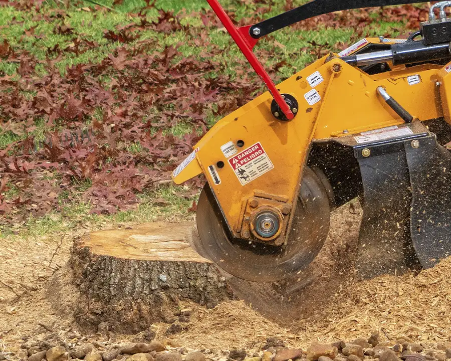 a landscaper performing stump grinding in sherman illinois